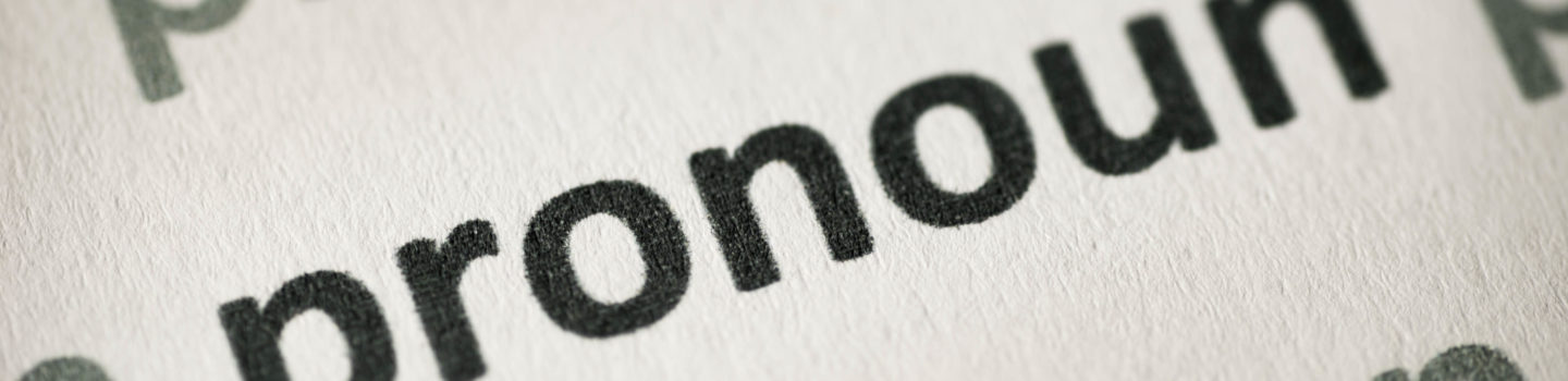 word pronoun printed on white paper macro