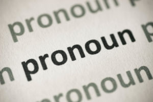 word pronoun printed on white paper macro