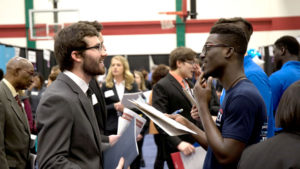 Student talks to employer at Career Fair