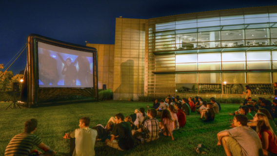 students viewing an outdoor movie screening