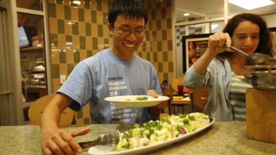Student preparing dinner plate