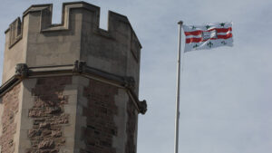 Brookings Hall tower with WashU flag